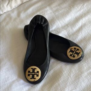Tory Burch Black and Gold Flats with Signature Medallion